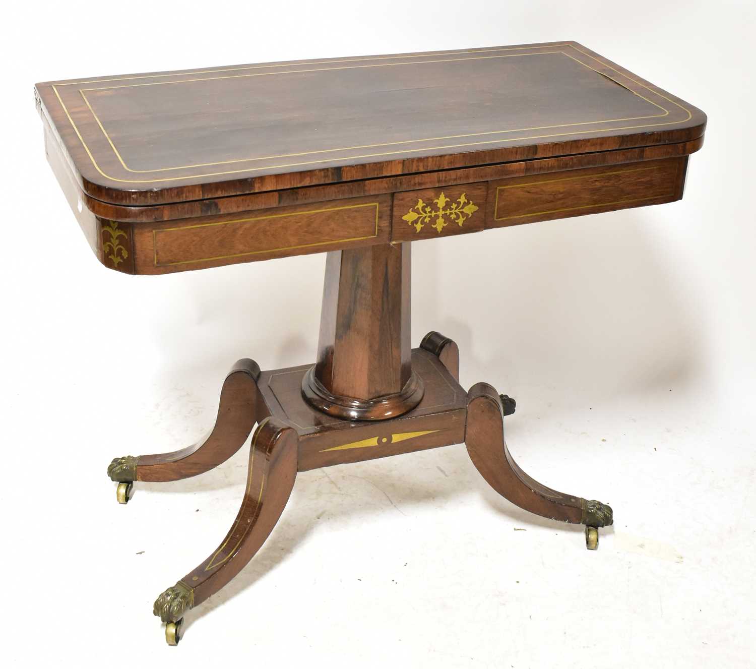 Lot 1 - A Regency brass-inlaid rosewood fold-over card...