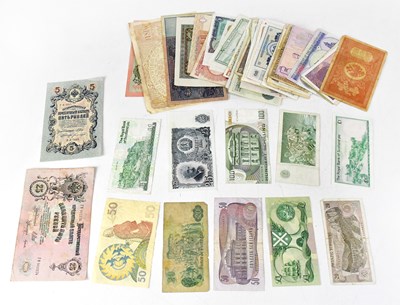 Lot 706 - A collection of UK and international banknotes...