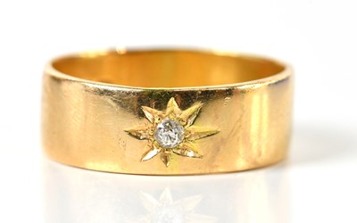 Lot 79 - An 18ct yellow gold diamond set wedding band,...