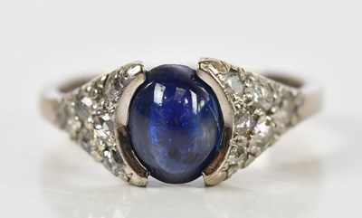 Lot 66 - An 18ct white gold star sapphire and diamond...