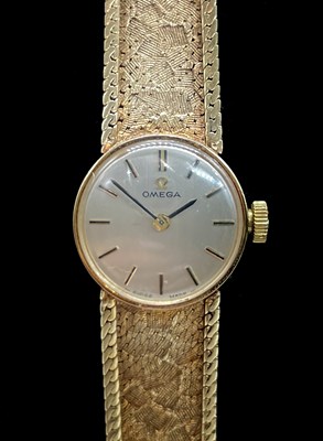 Lot 1348 - OMEGA; a lady's vintage 9ct gold wristwatch,...
