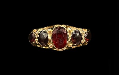 Lot 1190 - A 9ct rose gold and five stone graduated...