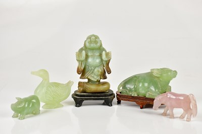Lot 1354 - A Chinese hardstone model of a buffalo, on...