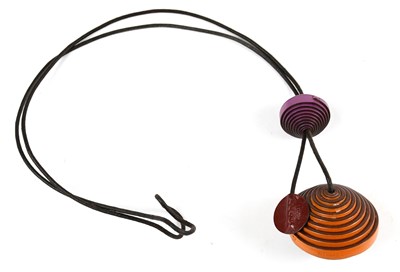 Lot 825 - HERMÈS; a leather orange sphere pendant...