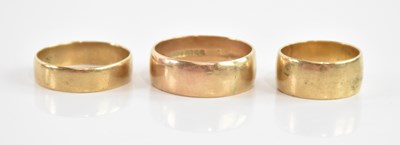 Lot 85 - Three 9ct yellow gold wedding bands, sizes N,...