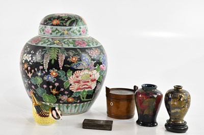Lot 1595 - WILLIAM MOORCROFT; a squat vase in the...