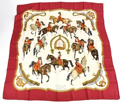 Lot 762 - HERMÈS; a 100% silk red, cream and brown...
