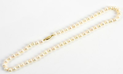 Lot 401 - A pearl necklace with yellow metal clasp...