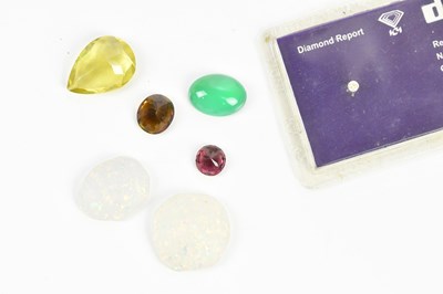 Lot 410 - A collection of loose gemstones, including...