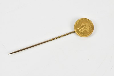 Lot 2362 - A yellow metal stick pin set with American one...