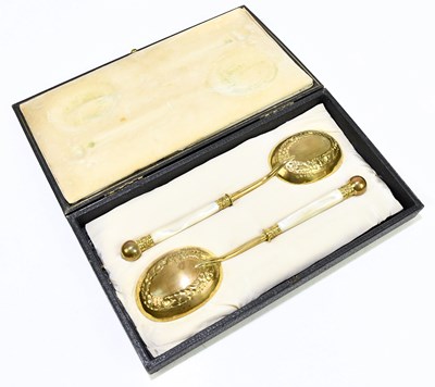 Lot 2025 - A pair of late Victorian gilt plated serving...