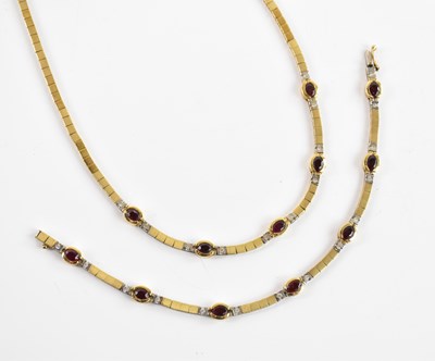 Lot 312 - An 18ct yellow gold ruby and diamond set...