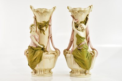 Lot 1454 - ROYAL DUX; a pair of Art Nouveau figural vases...