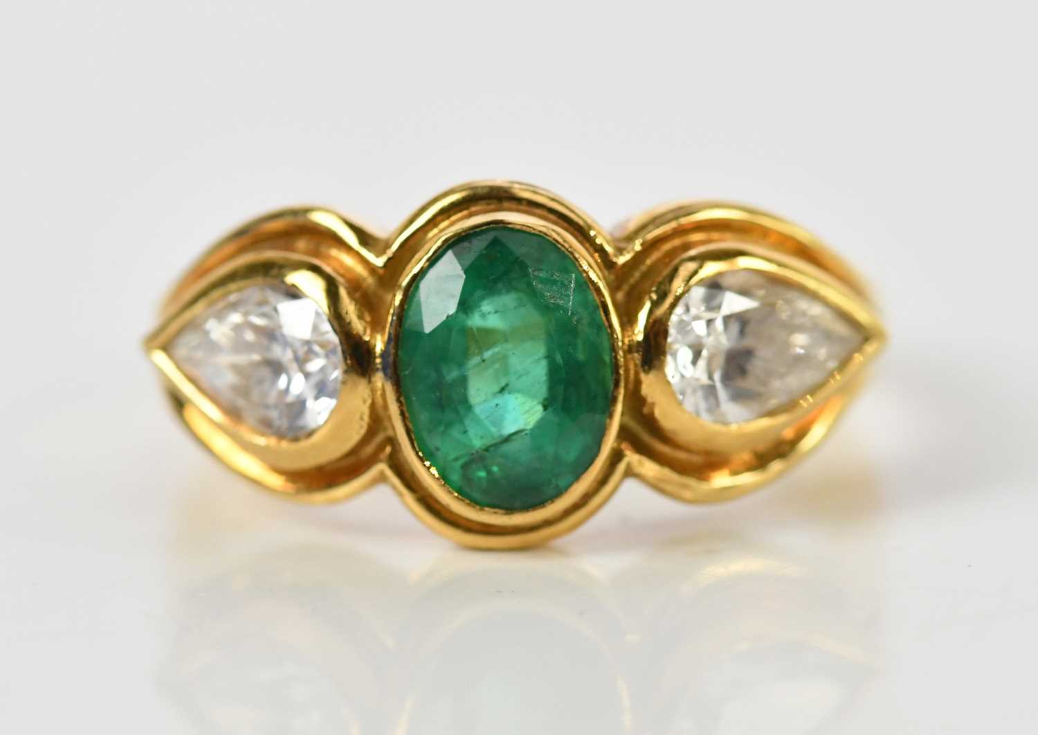 Lot 39 - An 18ct yellow gold emerald and diamond ring...