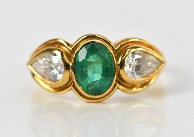 Lot 39 - An 18ct yellow gold emerald and diamond ring...