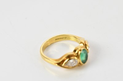 Lot 39 - An 18ct yellow gold emerald and diamond ring...