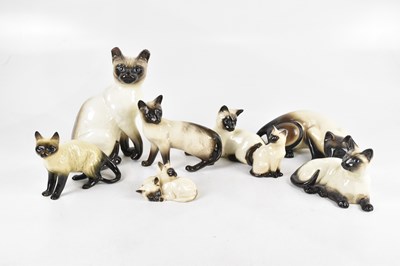 Lot 1489 - A collection of ceramic cats, including...