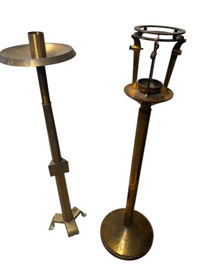 Lot 1295 - Two brass ecclesiastical freestanding candle...