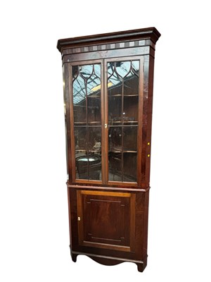 Lot 1056 - A Georgian mahogany freestanding corner...