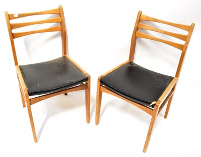 Lot 17A - Two 1970s oak framed bar-back dining chairs...