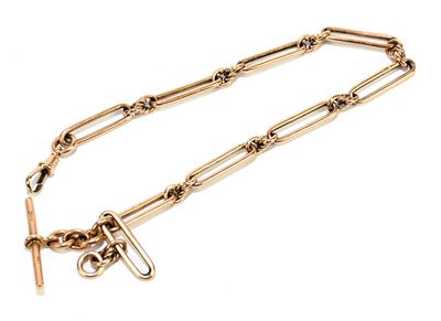Lot 1838 - A 9ct rose gold fancy link Albert chain and...
