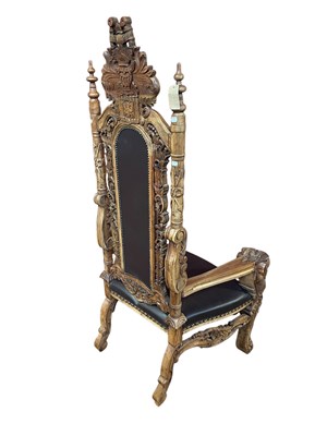 Lot 37 - A reproduction Continental carved hardwood and...