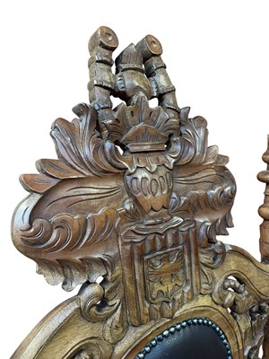 Lot 37 - A reproduction Continental carved hardwood and...