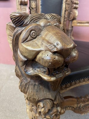 Lot 37 - A reproduction Continental carved hardwood and...