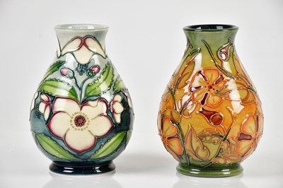 Lot 1424 - MOORCROFT; two baluster shaped vases including...
