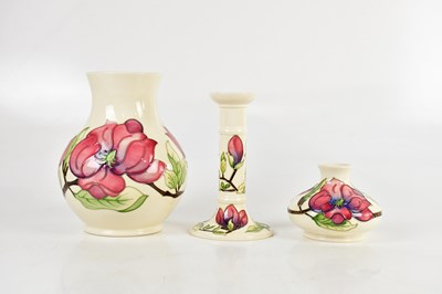Lot 1425 - MOORCROFT; three pieces decorated in the...