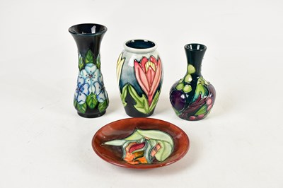 Lot 1433 - MOORCROFT; four pieces including a squat vase...