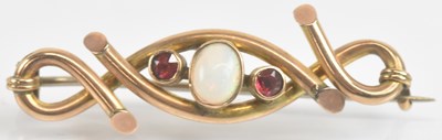 Lot 1372 - A 9ct gold crossover brooch with central bezel...