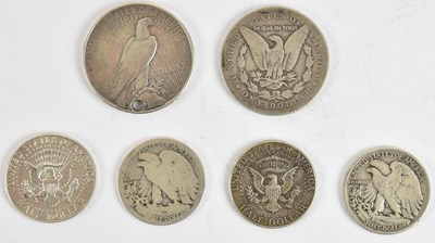 Lot 1593 - Six US coins including an 1897 Morgan 'O'...