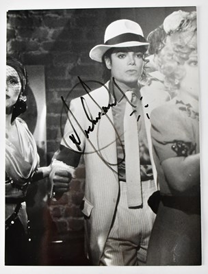 Lot 401 - MICHAEL JACKSON; a black and white signed...
