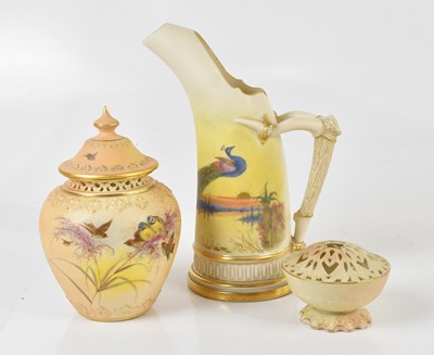 Lot 1608 - ROYAL WORCESTER; a hand painted ewer with horn...