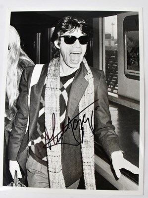 Lot 431 - MICK JAGGER; a signed black and white...