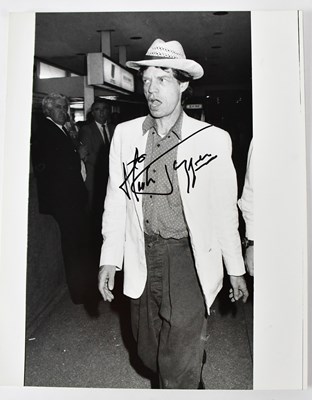 Lot 432 - MICK JAGGER; a signed black and white...
