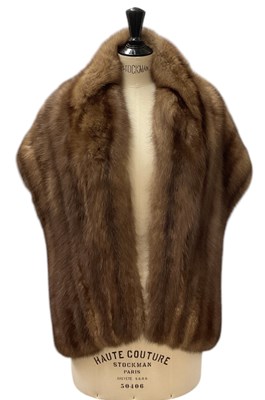 Lot 493 - A pale brown mink fur shawl.
