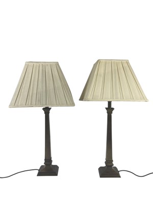 Lot 1315 - A pair of modern brass table lamps, with...