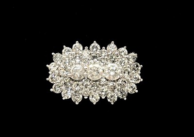 Lot 1298 - A white metal diamond cluster ring set with...