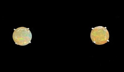 Lot 1301 - A pair of 9ct white gold opal ear studs,...
