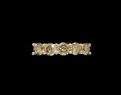 Lot 1304 - A 9ct yellow gold five stone diamond ring, the...