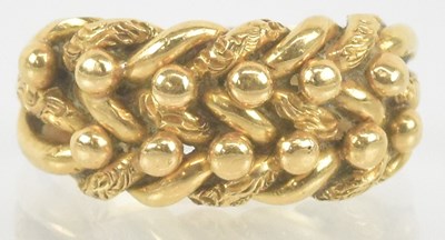 Lot 1270 - An 18ct yellow gold weave type ring, size I/J,...