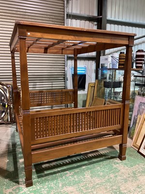 Lot 574 - A rustic solid teak four poster bed, height...