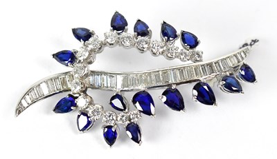 Lot 841 - A white metal brooch in the form of a stylised...