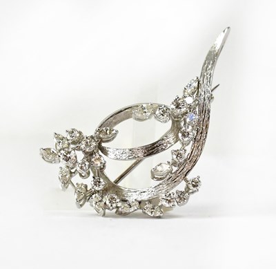 Lot 844 - A white metal brooch in the form of a spray of...