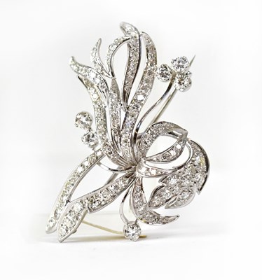 Lot 839 - An 18ct white gold brooch in the form of a...
