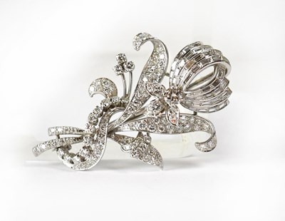 Lot 846 - A white metal brooch in the form of an orchid,...