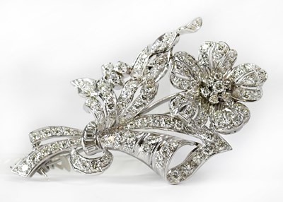 Lot 847 - A white metal brooch in the form of a single...