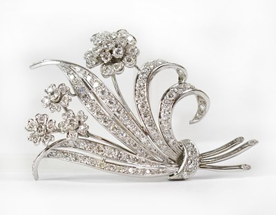 Lot 848 - A white metal brooch in the form of a spray of...